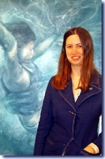 Jeanne Stern ’03 stands before her painting, "Struggle”