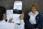 Ginny Emerson &acute;83 has her caricature done.<em><span style=font-size:9pt;>&nbsp;Credit: A. Vincent Scarano</span></em>