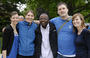 Young alumni stop to pose for a picture.<em><span style=font-size:9pt;>&nbsp;Credit: A. Vincent Scarano</span></em>