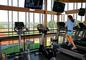 A student runs with a view of the Thames River in the College's new fitness center.