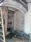 Workers have exposed an original arch at an entrance on the north side of the building. It will be restored.