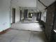 The south side of an upper floor, partitions removed between offices and classrooms.