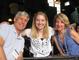 Stanley Brooks P’13, Hadley Brooks ’13 and Leslee Brooks P’13 enjoy some family bonding time at the Bleacher Bar after the Fenway tour.