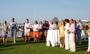 Guests at the Nantucket reception listen to Roger Brooks, dean of faculty.