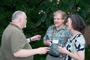Dean of the Faculty Roger Brooks, left, talks with guests at the Cape Cod reception.