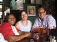 Katrina Sanders '92, Bethany Waywell Jay '99 and Hunter Jay enjoy refreshments after the tour of Fenway Park.