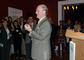 President Higdon welcomes guests to the holiday party in Boston.
