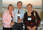 Wayne Swanson, professor emeritus of government, with two of his former students at a cocktail reception hosted by the the Connecticut College Club of Southwest Florida.