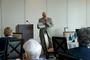 Ronald J.O. Flores, associate professor of sociology, speaks at a Meet the Faculty event in Naples, Florida.