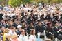 Graduates watch as their classmates receive their diplomas during Commencement 2012.<em><span style=font-size:9pt;>&nbsp;Credit: Bob MacDonnell</span></em>