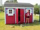 Zoe Lynch '15 takes a break from painting the shed that will house equipment and supplies for the new Sprout garden.<em><span style=font-size:9pt;>&nbsp;Credit: Photo by Eileen Jenkins</span></em>