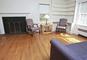 The living room of 3 Gallows Lane, a new student residence, features a fireplace and built-in bookshelves.<em><span style=font-size:9pt;>&nbsp;Credit: Photo by Bob MacDonnell</span></em>