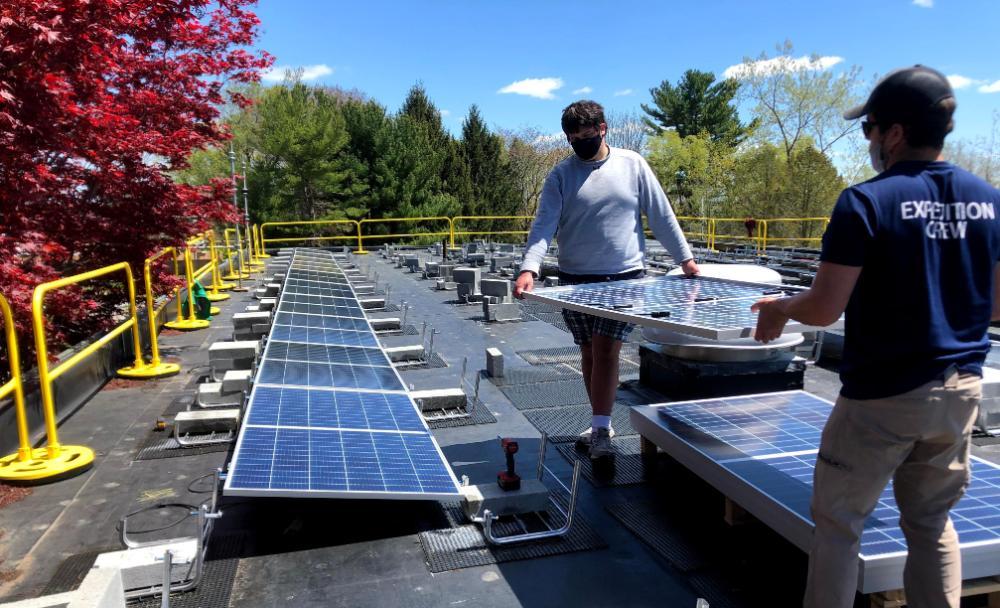 Students installing solar array