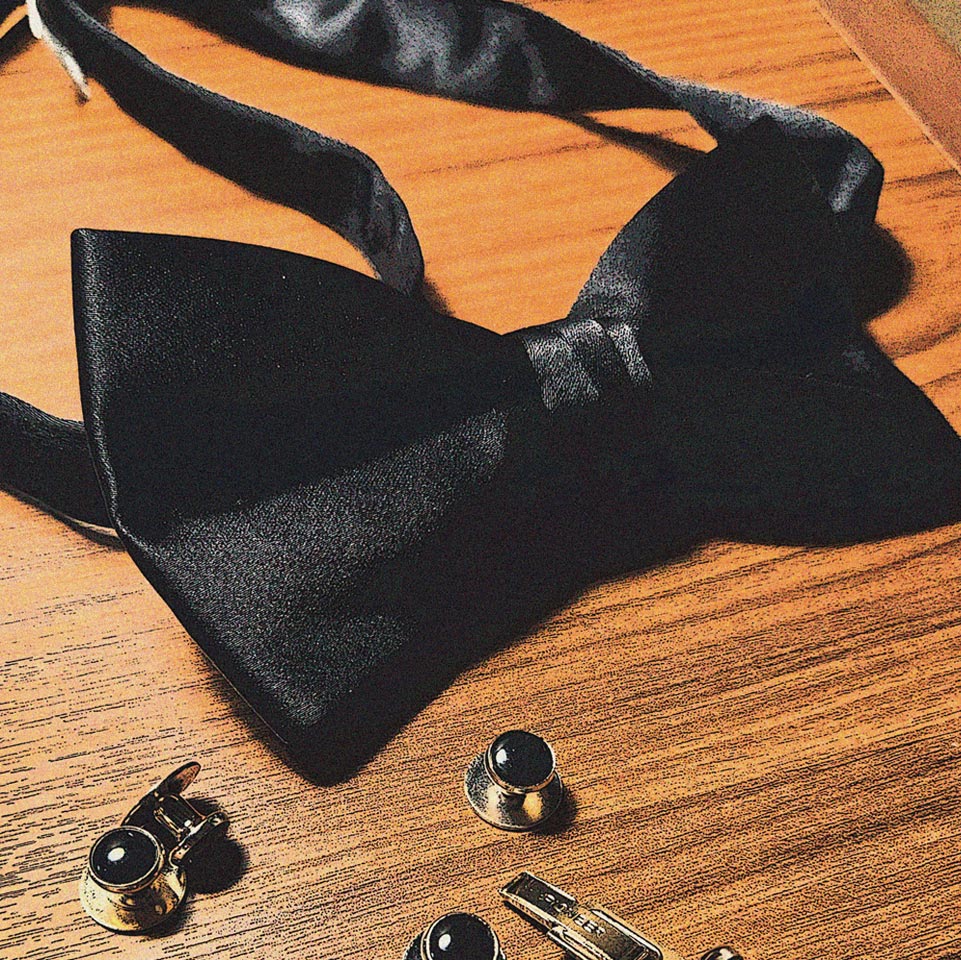 Abstract image of a bow tie and cuff links