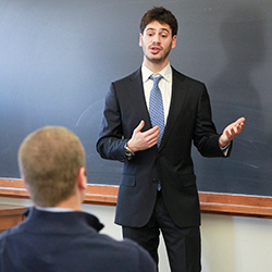 Sam Siegel-Wallace '15 gives a presentation on the last day of the Now Hiring! workshop. (Homepage: Steven Natera '15, far right, presents to Connecticut College career advisers and representatives from Preston Ridge Vineyards.) 