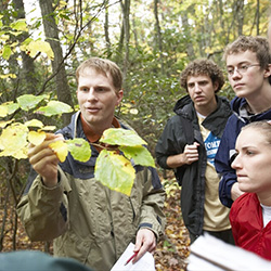 Chad Jones, associate professor of botany and faculty director of the Office of Sustainability at Connecticut College, teaches a class in the College's 750-acre arboretum.  