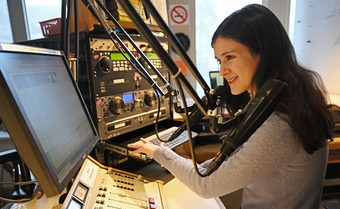Riley Madden ’26 broadcasts her weekly radio show, “Pirate Radio” from the studios at WCNI