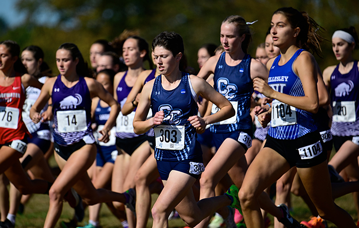 The Women's Cross Country team running in a race.
