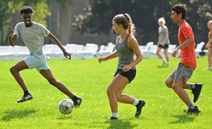 Students playing soccer