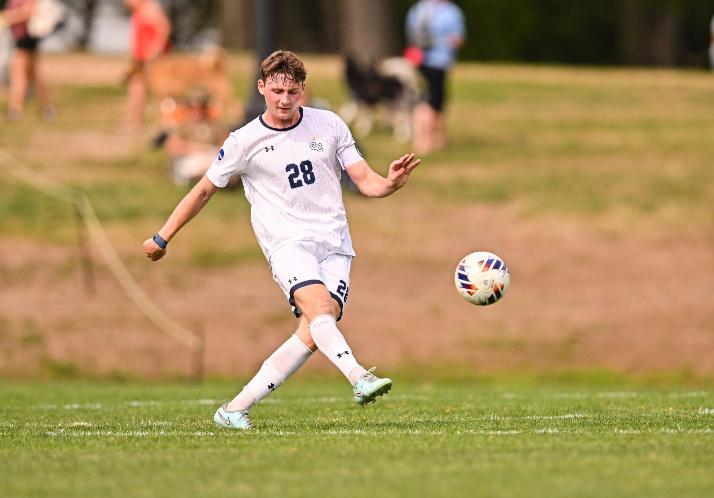 Student playing soccer