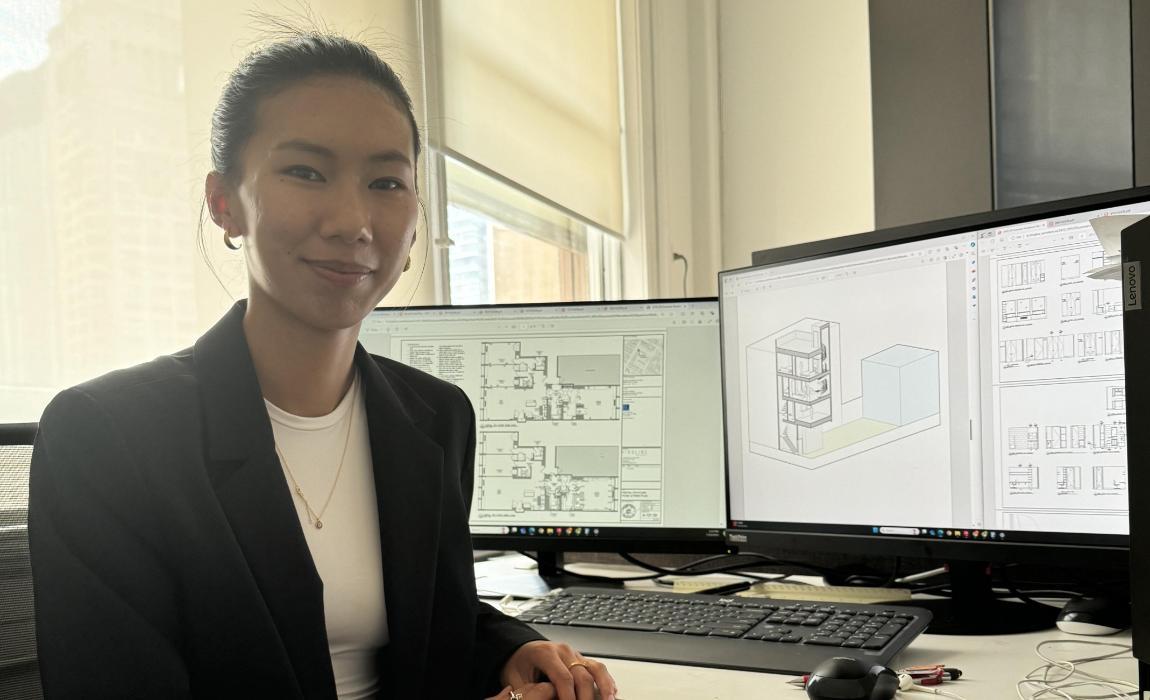 Kinley Yangden poses in front of her desk at her internship.