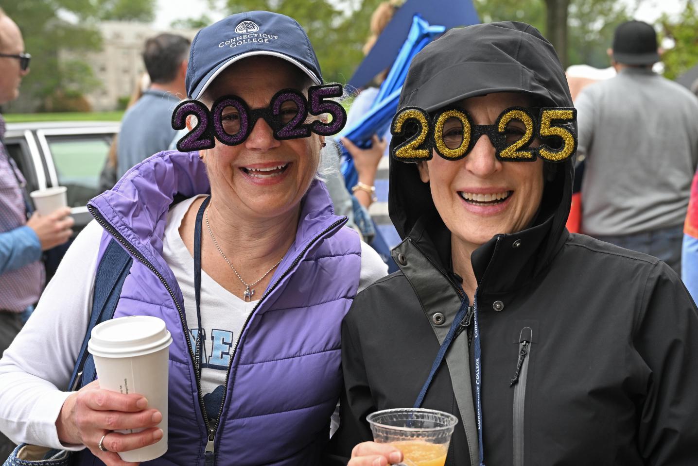 Women wearing 2025 glasses at reunion