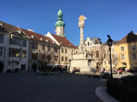 The town square with a view of the Fire Tower and Plague Memorial in Sopron, Hungary