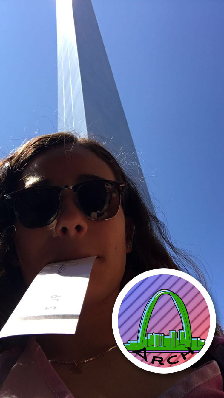 Dani takes a selfie at the bottom of the Arch with an 