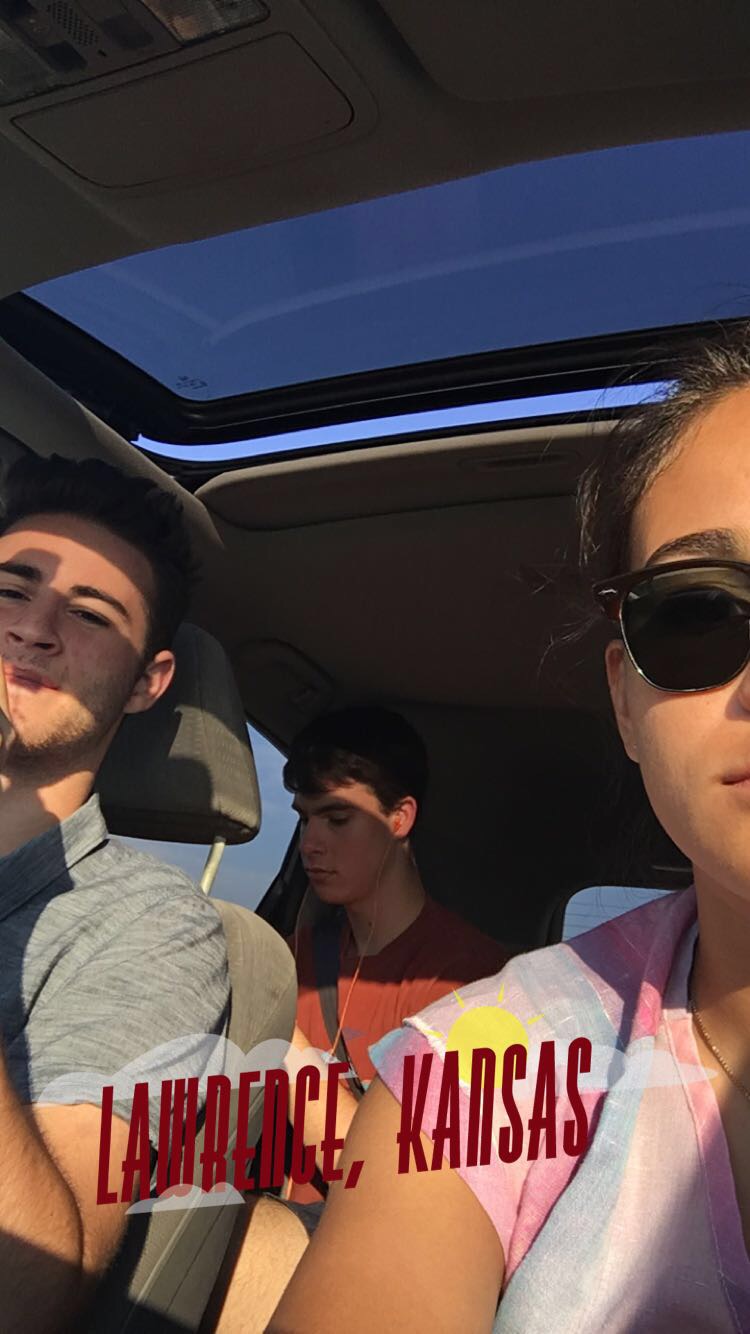 Dani, Mark and Samuel take a car selfie with a Lawrence, Kansas, geofilter.