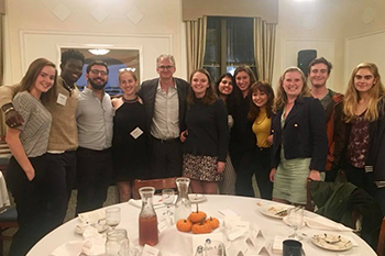 Timothy Snyder with group of students at dinner