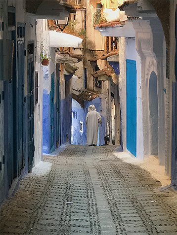 Man walking in alleyway in Morocco