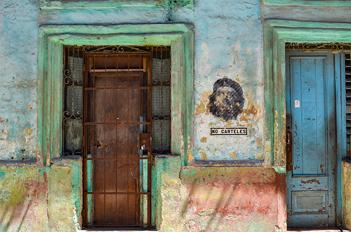 Mural in Havana, Cuba with sign, 