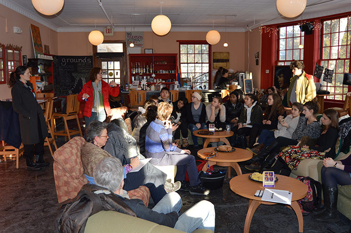Students and faculty gather in Coffee Grounds for a discussion. 