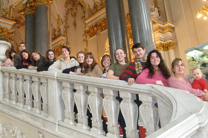 Slavic Students students and faculty pose in a historic Russian building.
