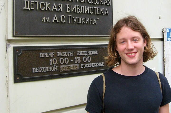 A Slavic Studies student poses in front of a Russian building. 