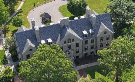 An aerial photo of campus from the chapel looking out over the green of the arboretum.