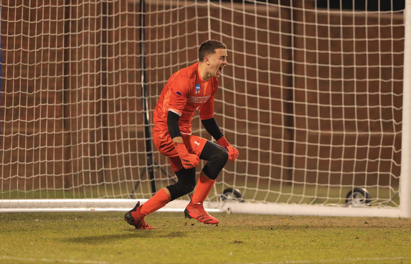 Goalkeeper Peter Silvester ’25 gets hyped up after stopping a penalty kick at the NCAA championship game 