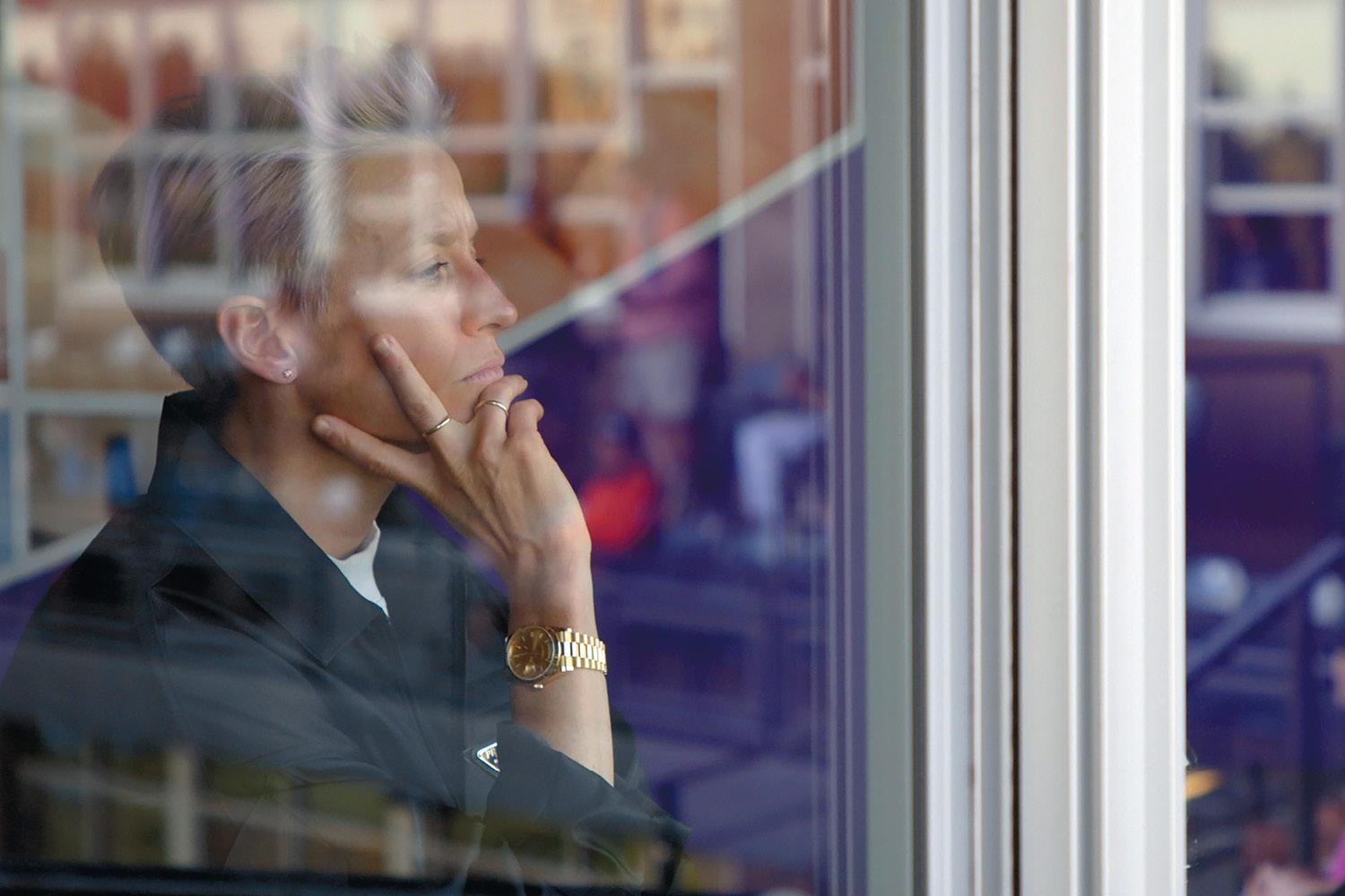 Image of Megan Rapinoe looking out a window