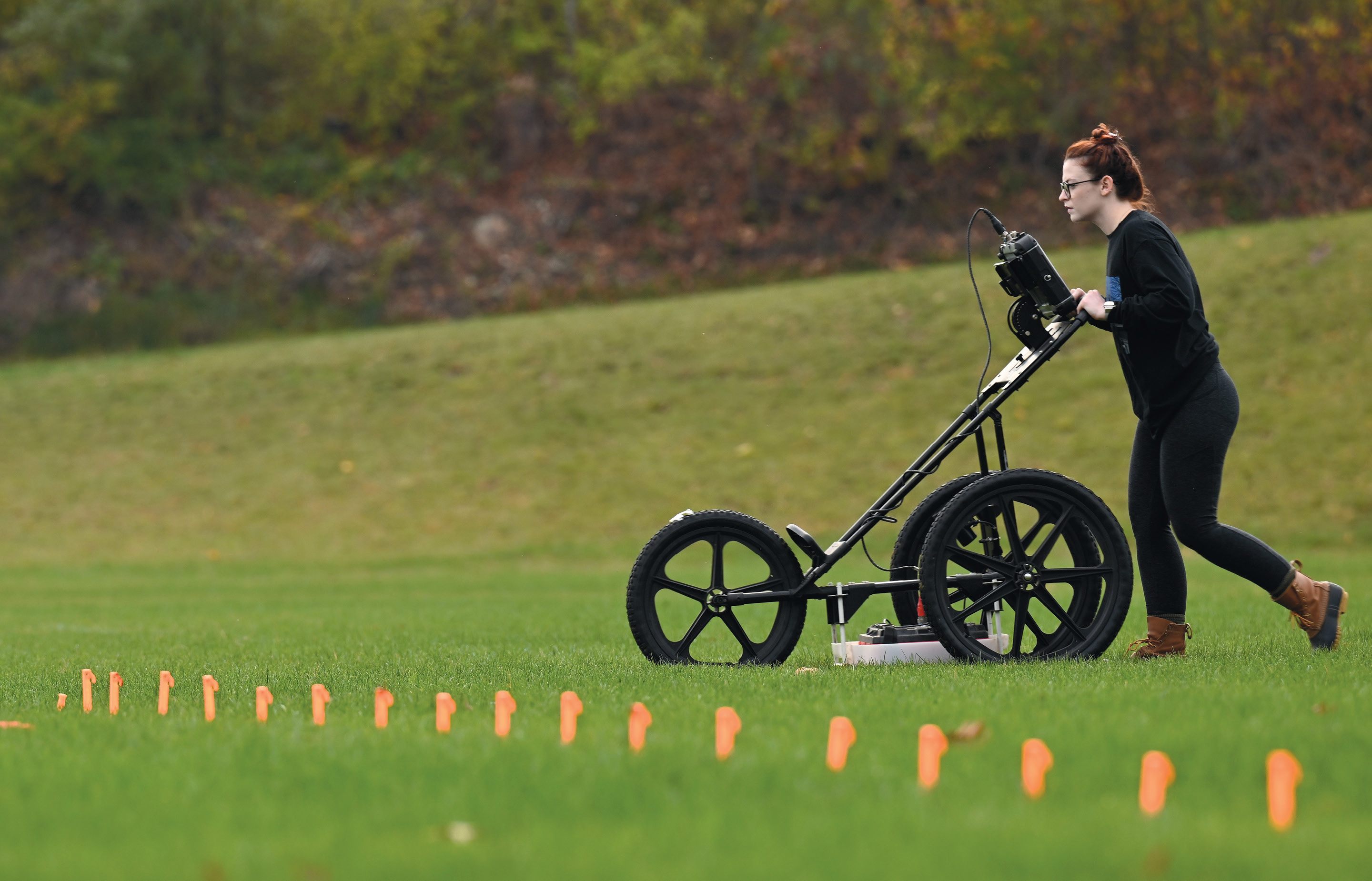 A TerraSearch Geophysical employee surveys the athletic fields near Conn’s waterfront.