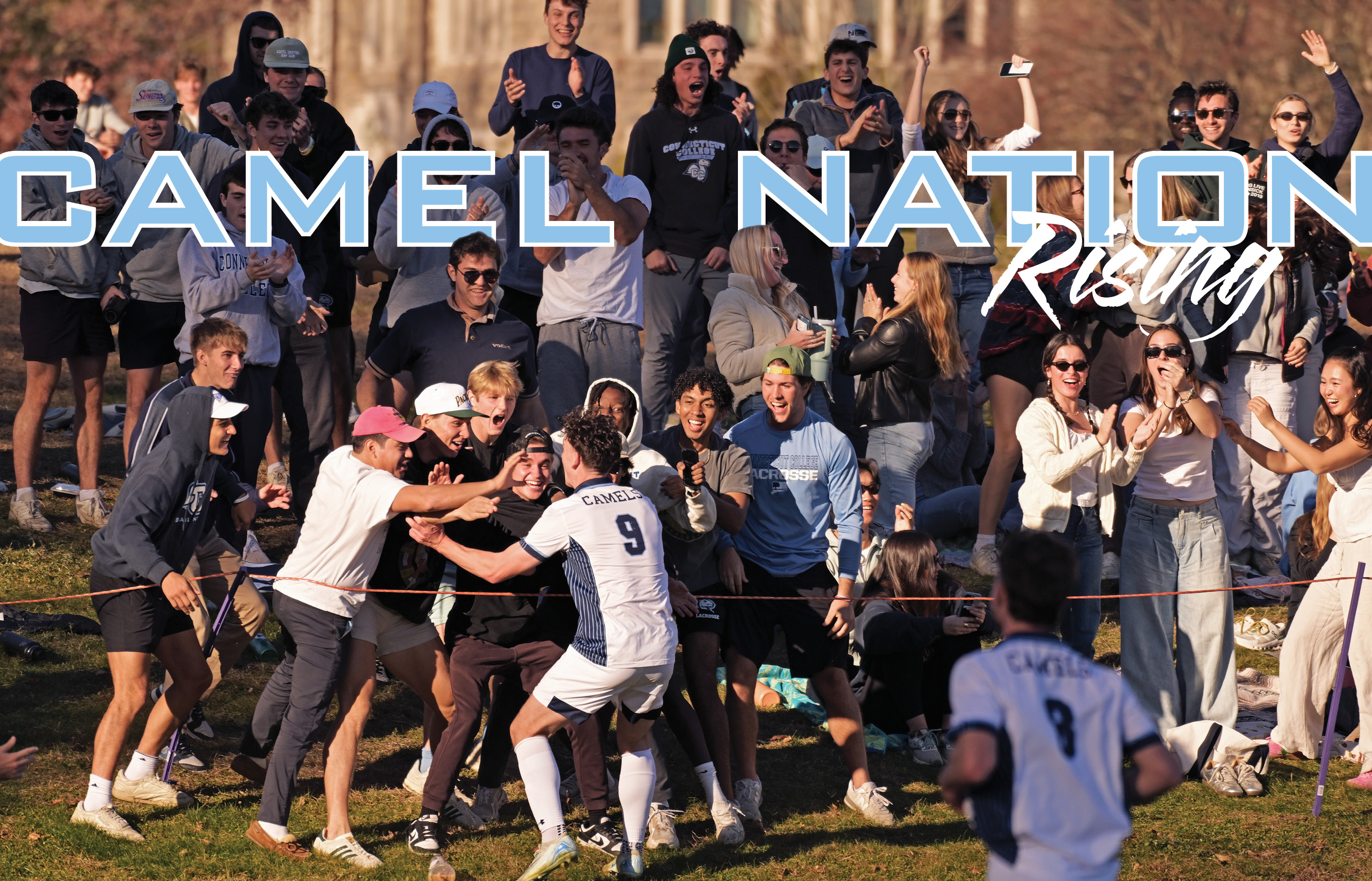 A crowd cheers on the men