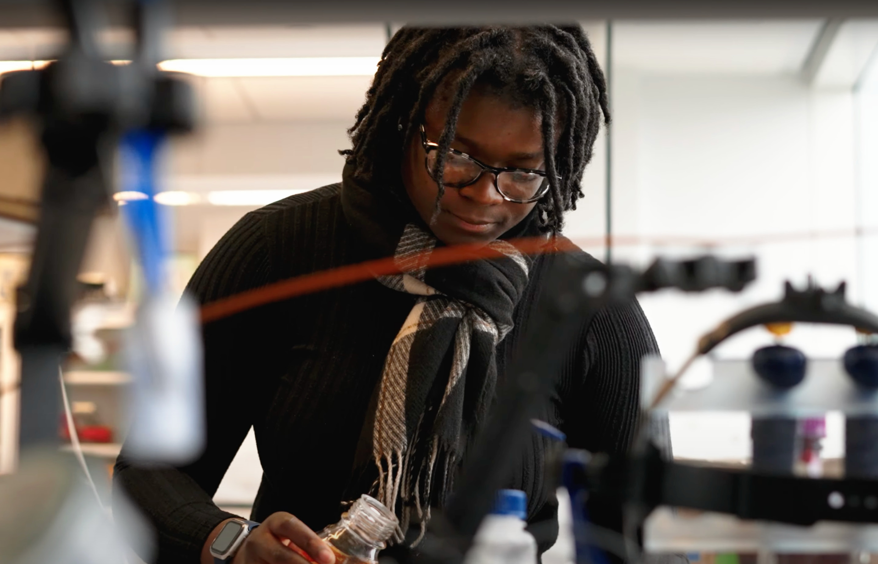 Anike Roberson ’24, a food science Ph.D. student at Cornell, works in a lab.