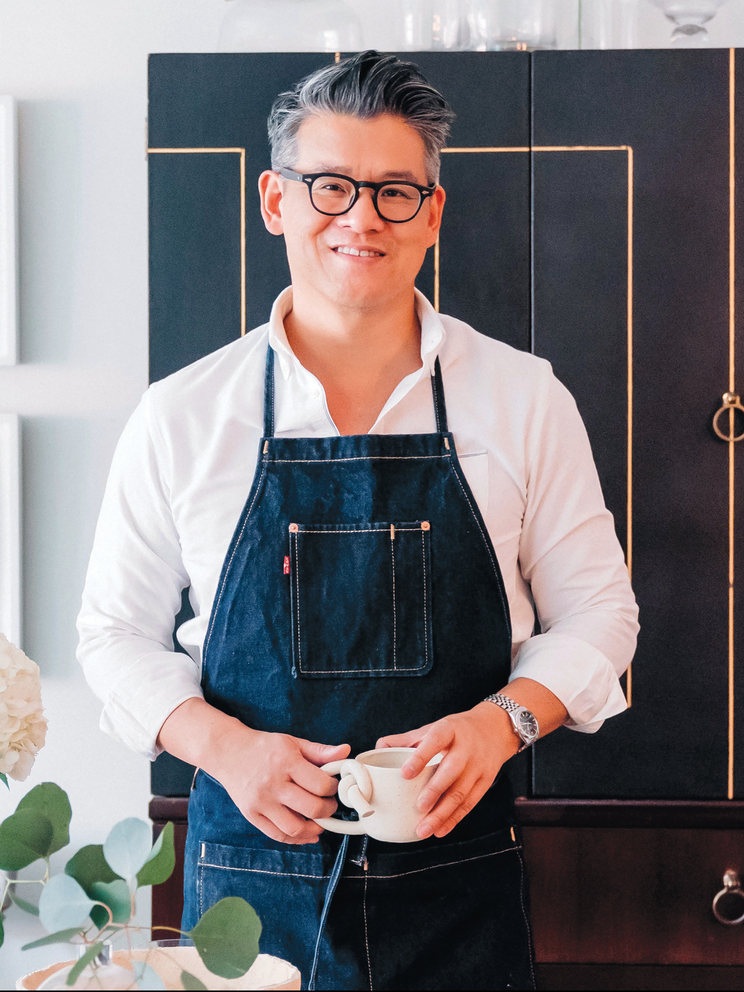 Image of Peter Som in a blue apron