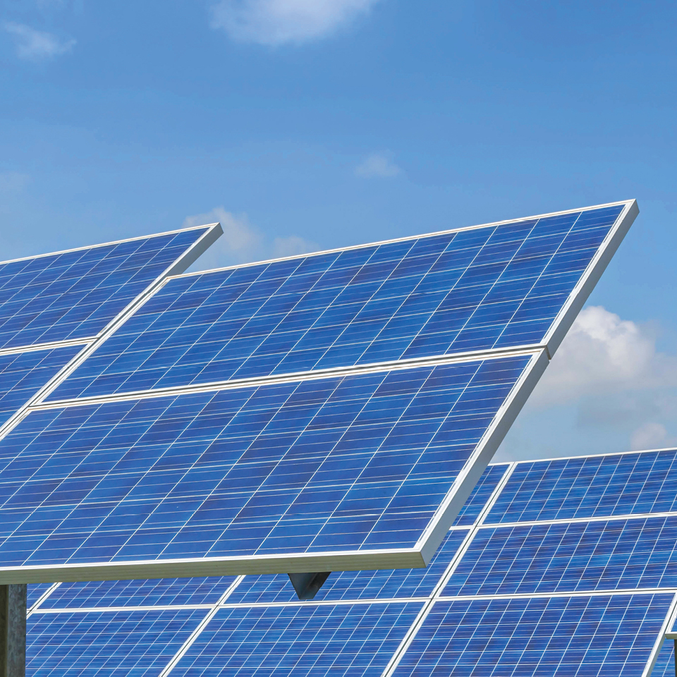 An image of solar panels under a blue sky