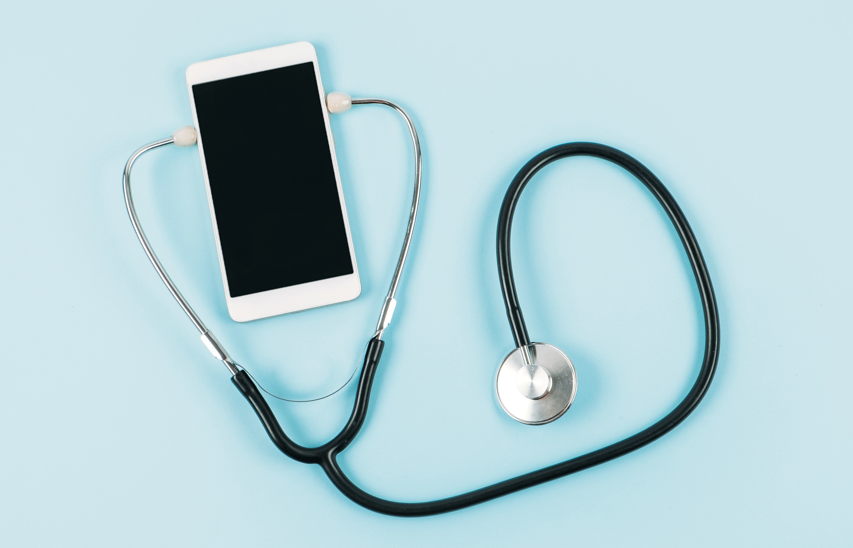 Graphic image of a smart phone with a stethoscope attached to it