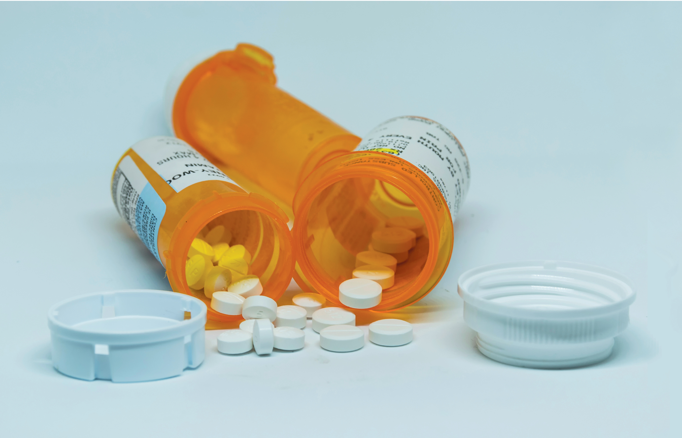 Graphic image of an open container of pills