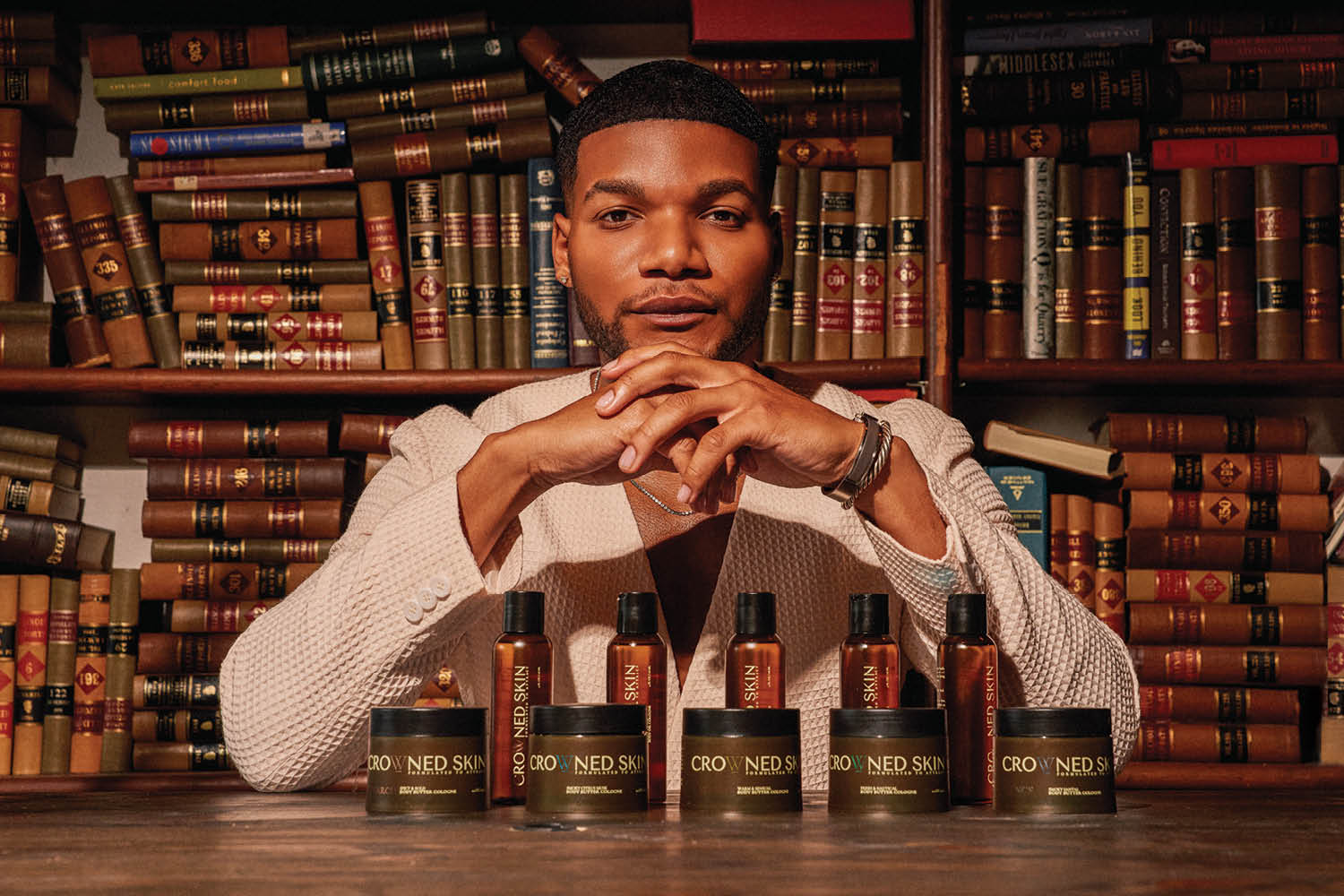 Image of Darrell Spencer ’18 in front of a wall of books