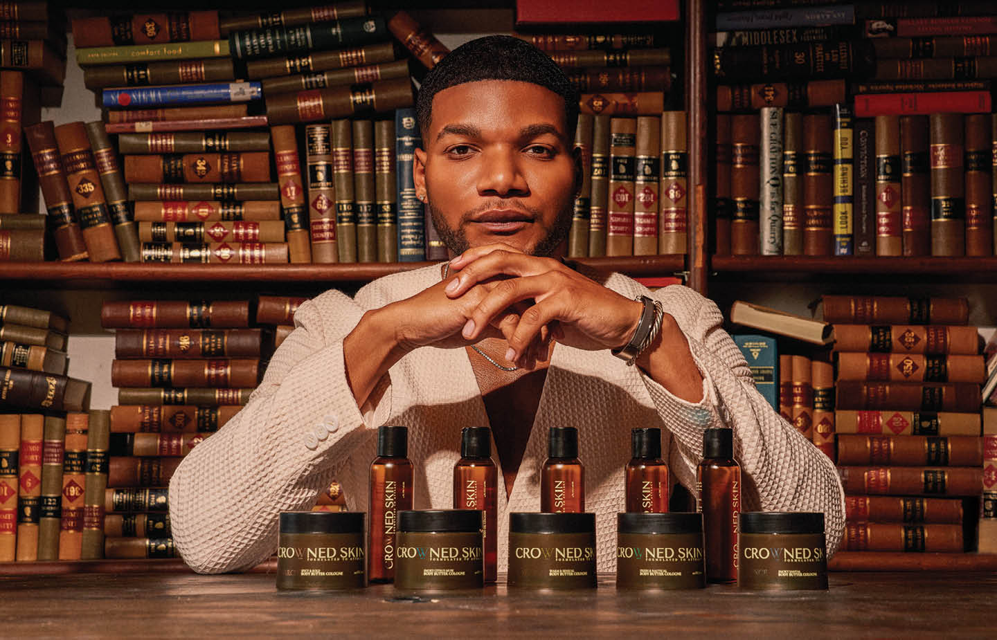 Image of Darrell Spencer ’18 in front of a wall of books