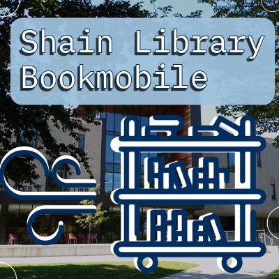 Shain Library Bookmobile sign with blue bookmobile graphic on outdoor campus