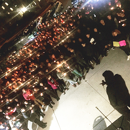 College students gathered outside of the College Center at Crozier-Williams in solidarity with students of color who have experienced racism on college campuses and in everyday life.