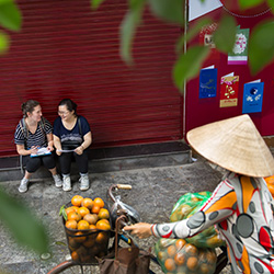 Susanna Mathews '16, far left, works with local translator Vuong Thu Trang to fill out a market research questionnaire after surveying food-buyers at a supermarket in Hanoi, Vietnam. Mathews is participating this semester in the College's Study Away Teach Away program, through which a group of students study for a semester abroad with one or two Connecticut College faculty members. More than half of all Connecticut College students complete an internship or study for a semester abroad, compared to less than 10 percent of college graduates nationwide. 